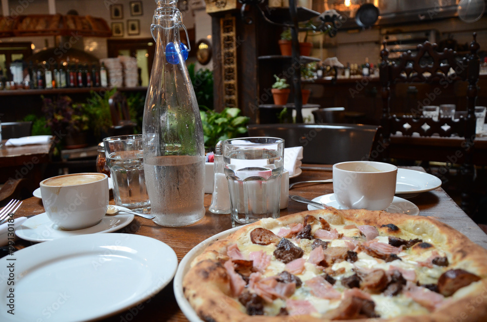Pizza on a table in a restaurant Pizza on a table in a restaurant