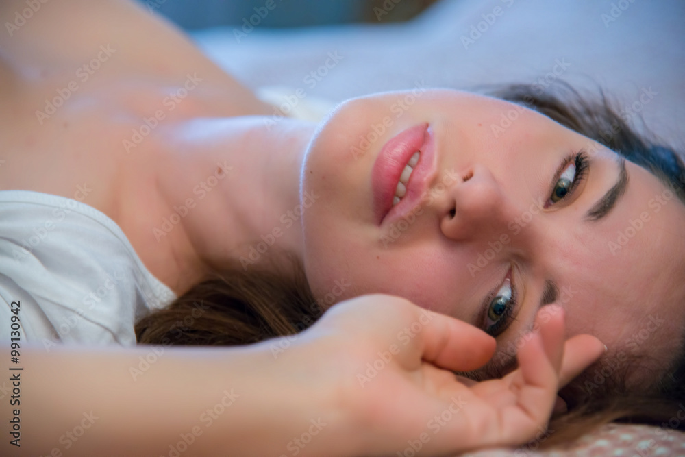 Beautiful naked woman in her bedroom at morning Beautiful naked woman in her bedroom at morning