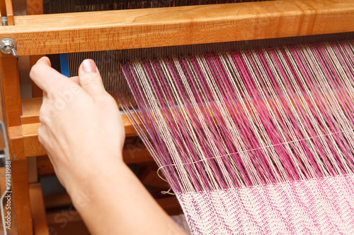 Εκτύπωση καμβά Hands of a woman who weaves on a loom