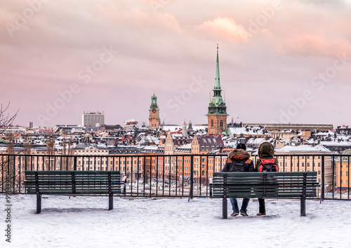 One winter afternoon at the Stockholm. Lovers at the hill of Sodermalm looking over the Stockholm Old Town (Gamla Stan). 
