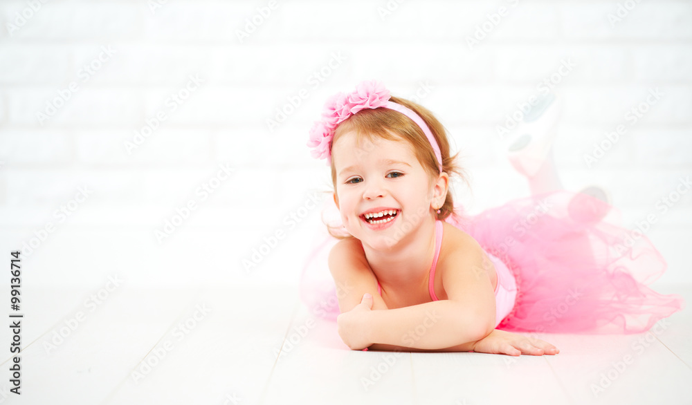 Fototapeta premium little child girl dreams of becoming ballerina