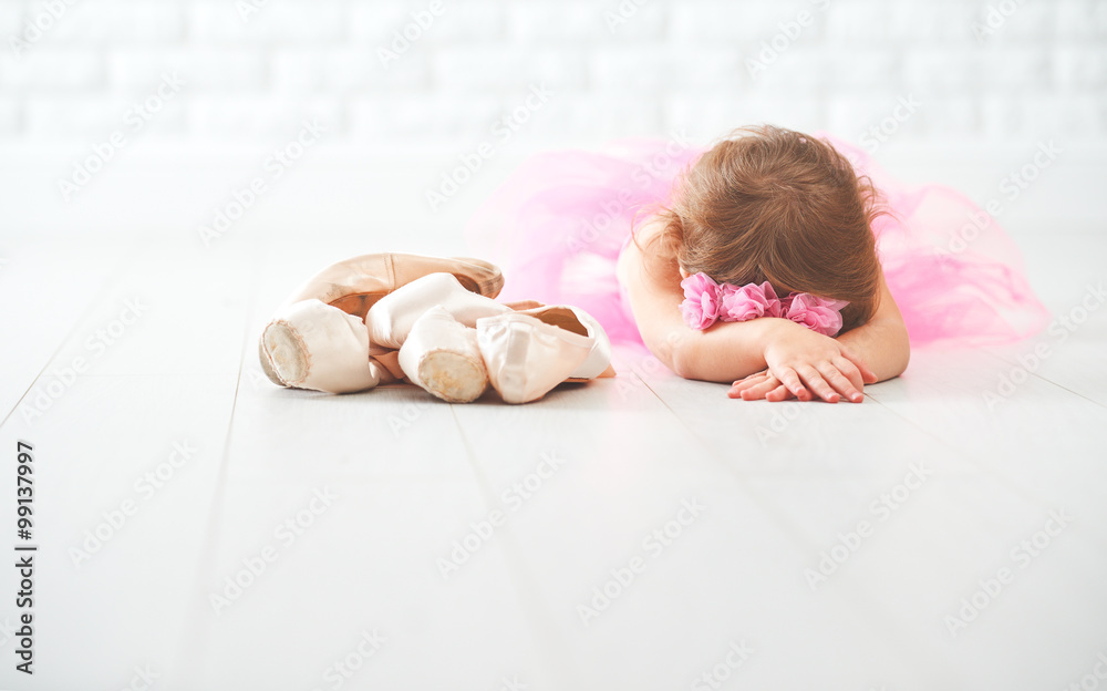 Naklejka premium little child girl ballerina with ballet shoes and pointe shoes