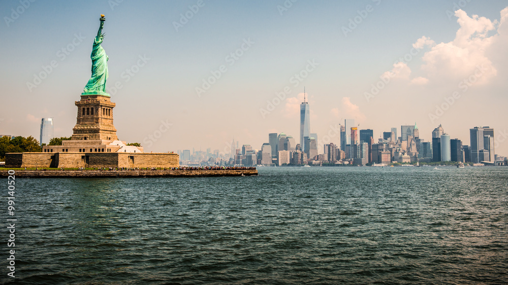 Statue of Liberty and New York skyline on the background