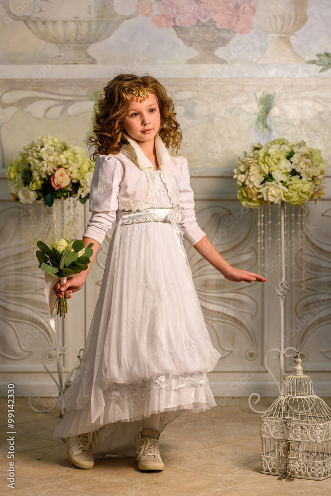 Fototapeta premium Little girl in dress with flowers