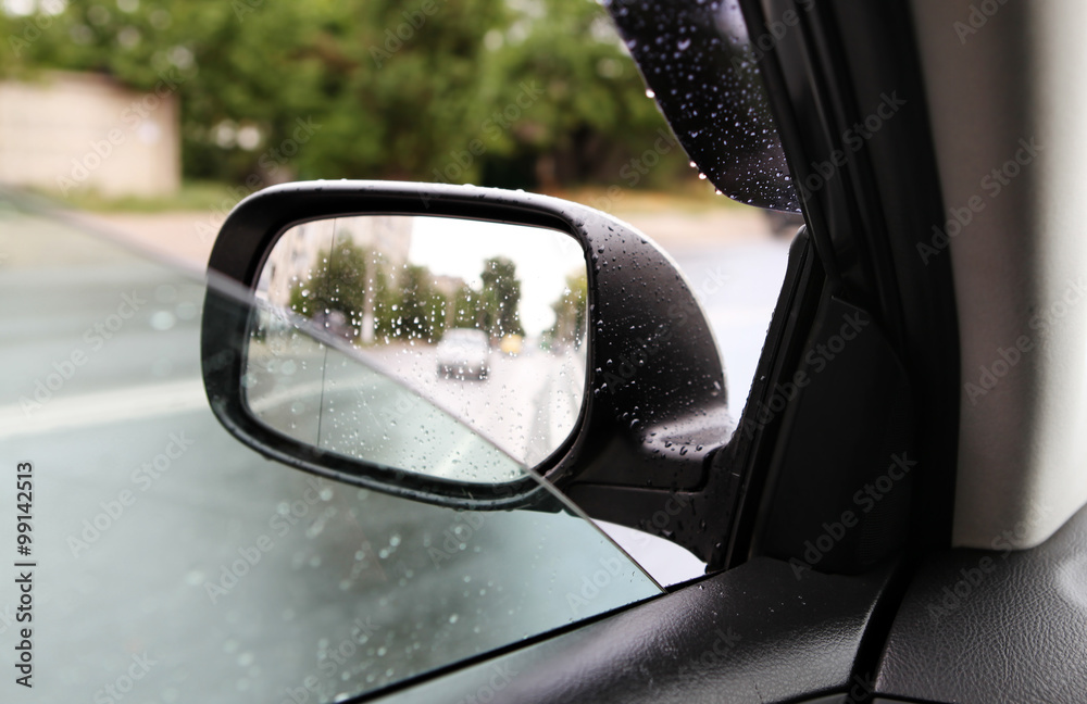 rear-view mirror in rainy weather