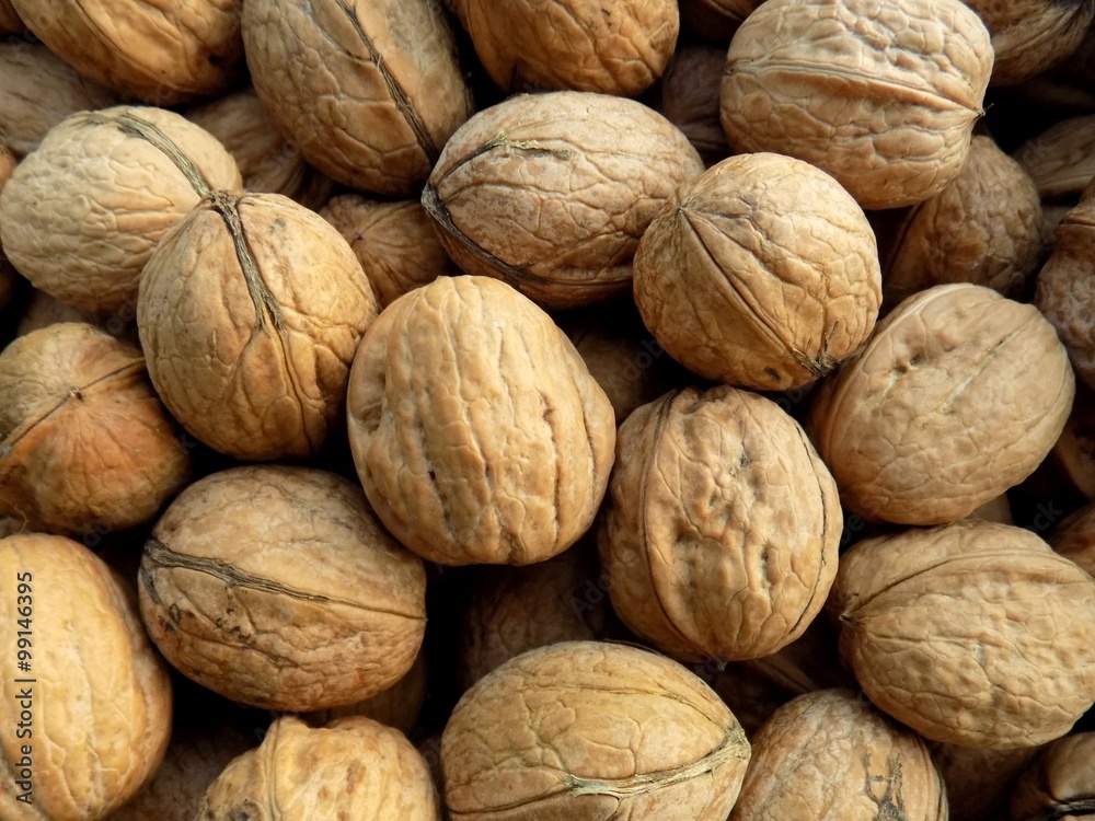 Walnuts in nutshell texture Walnuts in nutshell texture