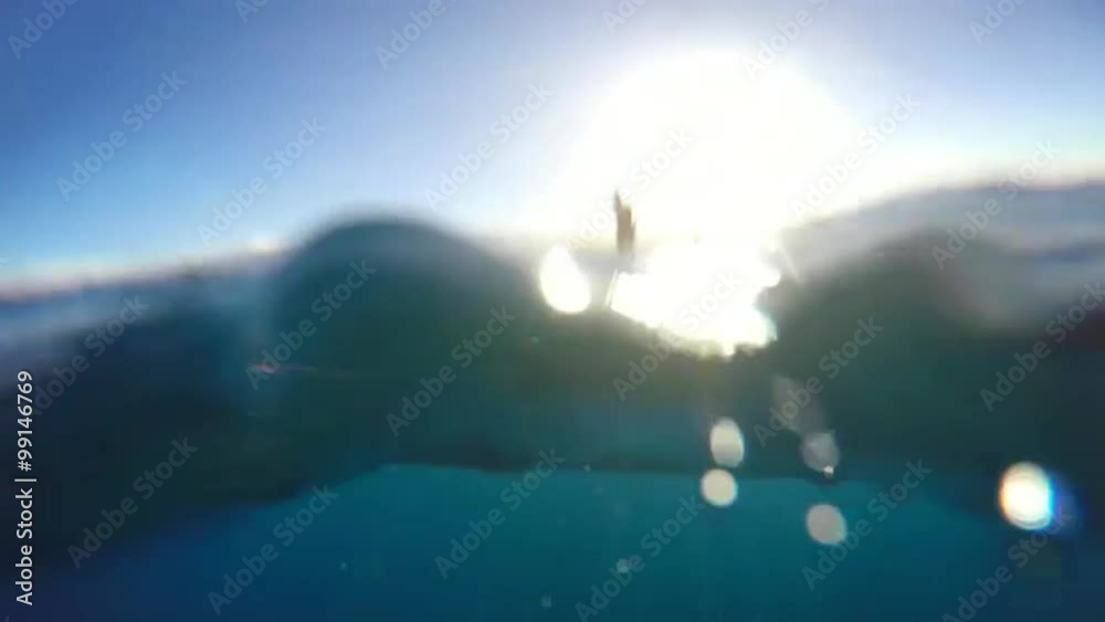 Young Attractive Woman Stand Up Paddle Boarding in Blue Ocean Young Attractive Woman Stand Up Paddle Boarding in Blue Ocean