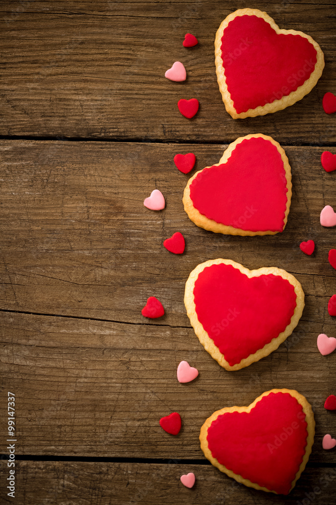 Fototapeta premium Cookies hearts on old wood background