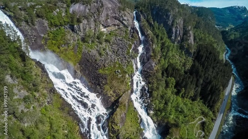 Aerial footage Latefossen Waterfall Odda Norway. Latefoss is a powerful, twin waterfall. View from the bird's-eye view. photo