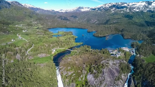 Aerial footage Latefossen Waterfall Odda Norway. Latefoss is a powerful, twin waterfall. View from the bird's-eye view. photo