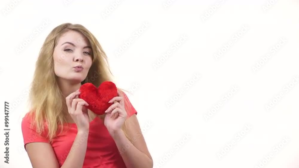 Woman blonde girl holding red heart love symbol 4K Woman blonde girl holding red heart love symbol 4K