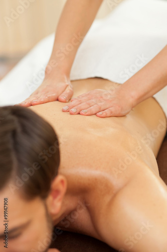 Experienced female therapist is massaging her customer