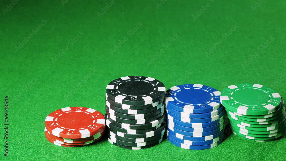 Man moves stacks of poker chips Man moves stacks of poker chips