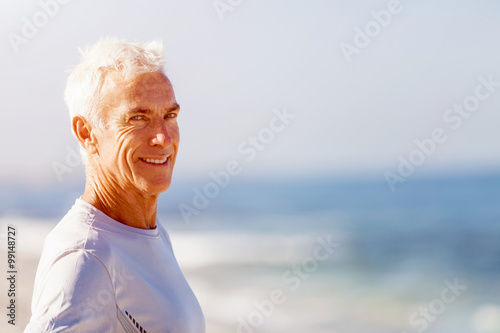 Man standing on beach in sports wear © Sergey Nivens