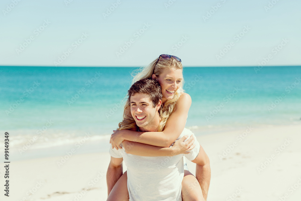 Portrait of man carrying girlfriend on his back Portrait of man carrying girlfriend on his back