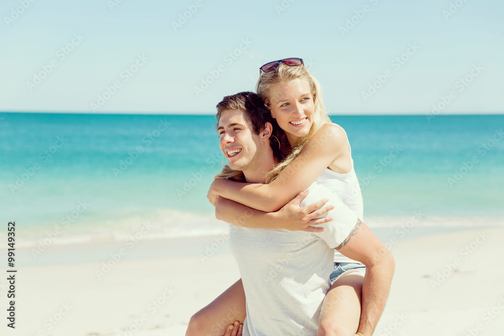 Portrait of man carrying girlfriend on his back Portrait of man carrying girlfriend on his back