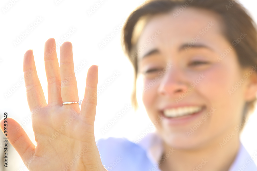 Woman looking an engagement ring after proposal Woman looking an engagement ring after proposal
