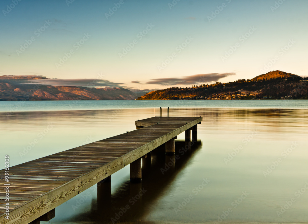 Fototapeta premium dock on mountain lake at sunrise