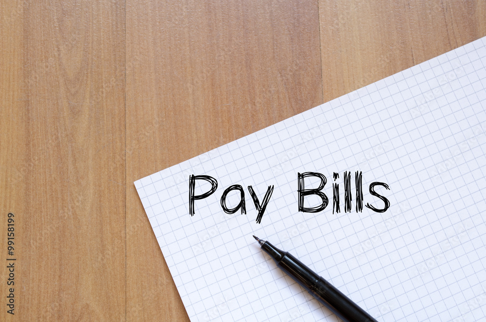 Pay bills write on notebook Pay bills write on notebook