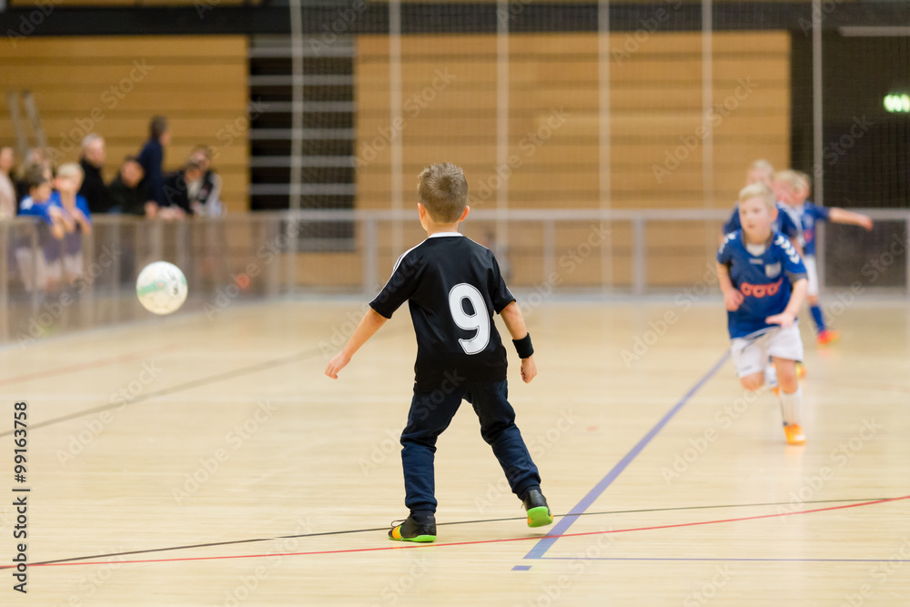Fototapeta premium Kids indoor soccer match