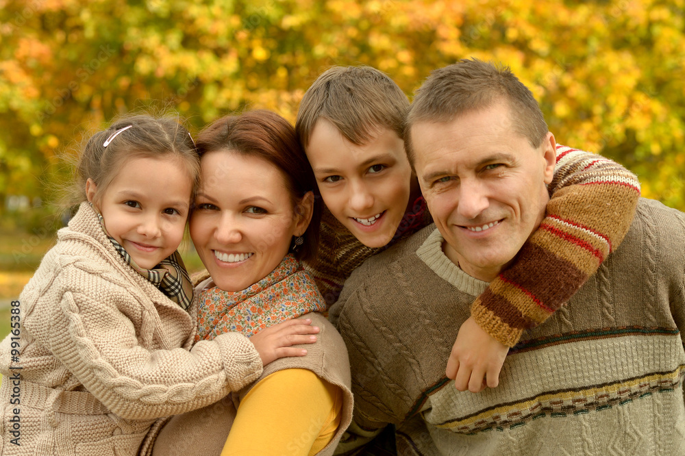 Fototapeta premium Happy family in autumn forest