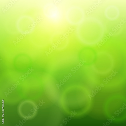 Green sunny background, glittering defocused bokeh