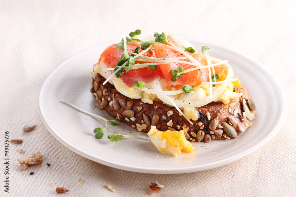 smashed egg and pickled onion on cereal rye bread. smashed egg and pickled onion on cereal rye bread.