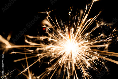 New Year sparkler on black background 