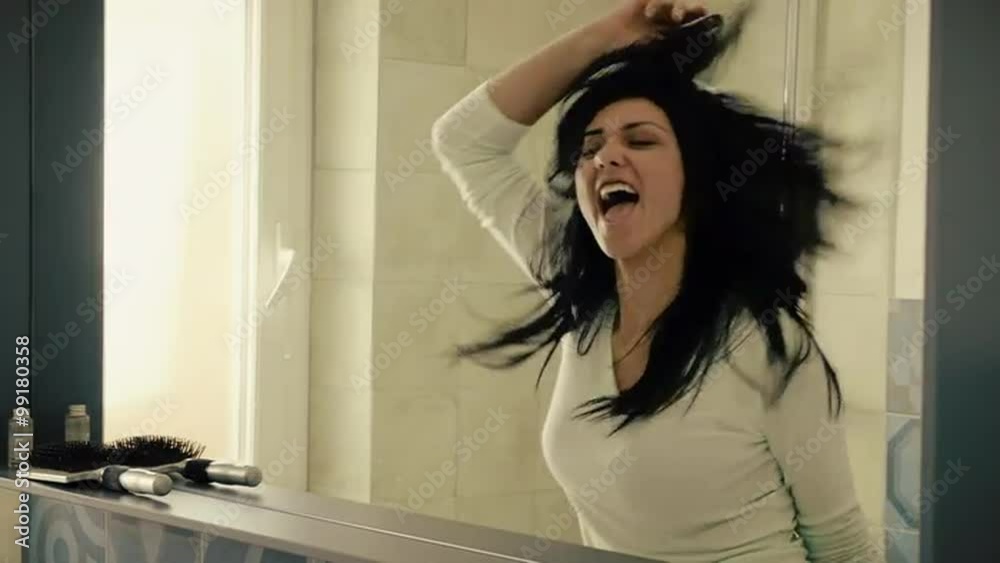 Beautiful brunette dancing in bathroom happy in the morning closeup Beautiful brunette dancing in bathroom happy in the morning closeup