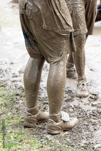 pair of very muddy shoes and legs © gkphotoart2012