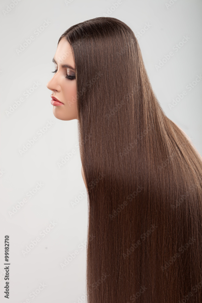 Fototapeta premium Beautiful young girl with pretty perfect hairstyle