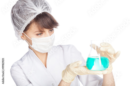 young scientist in mask look at flask with chemicals isolated on white