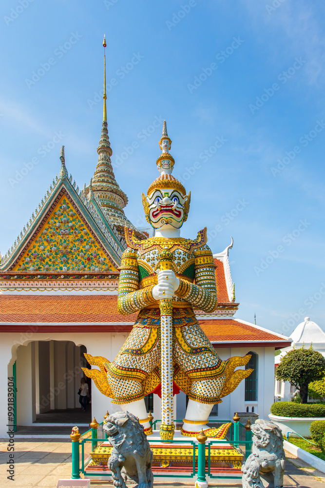 Giant in front of buddha temple in Bangkok Yai district of Bangkok, Thailand, on the Thonburi west bank of the Chao Phraya River.