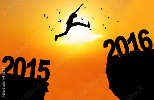 Man leap over cliff with numbers 2015 and 2016