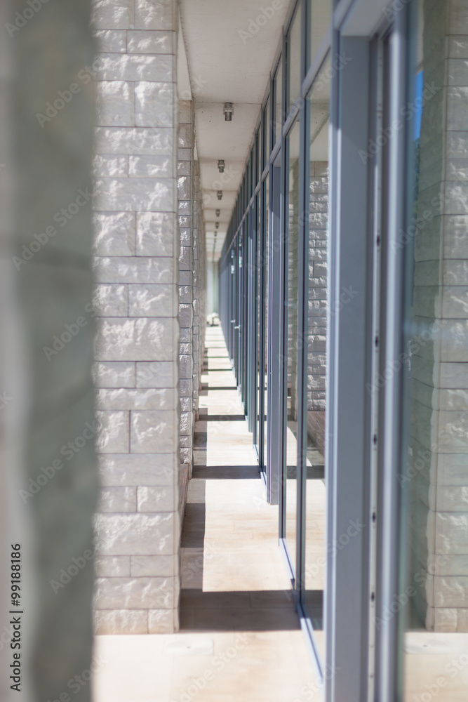 modern architecture corridor separating glass and stone facades modern architecture corridor separating glass and stone facades