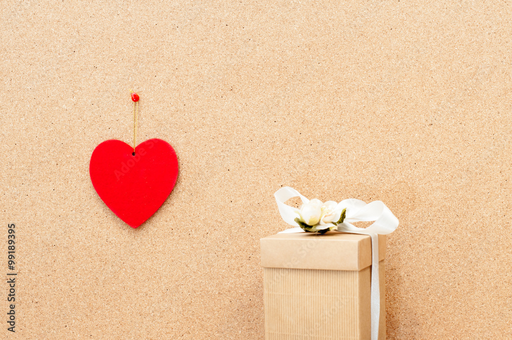 Fototapeta premium Valentine's day heart and gift box on wooden background