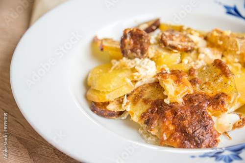 French potatoes with cheese and sausage