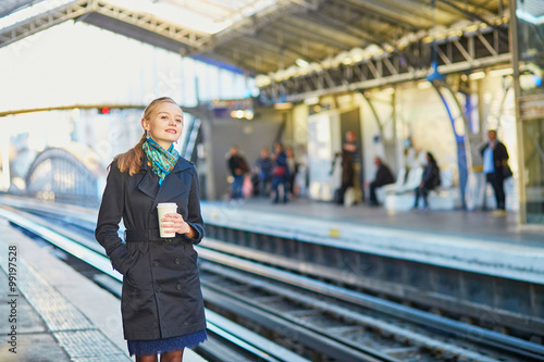 Wallpaper Mural Beautiful young woman waiting for a train in Parisian undergroun Torontodigital.ca