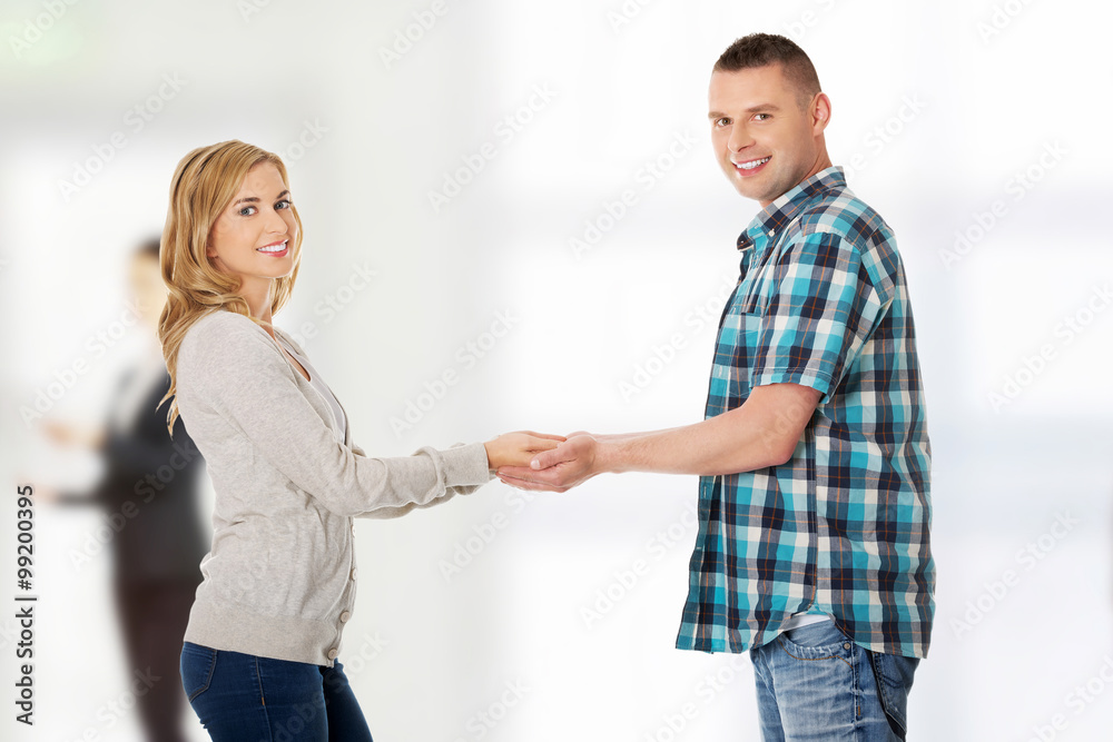 Happy couple holding hands Happy couple holding hands