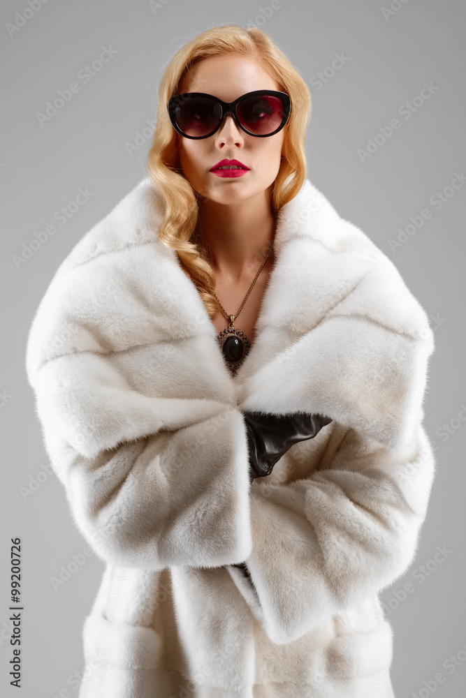attractive blonde lady with red lips in white fur coat attractive blonde lady with red lips in white fur coat