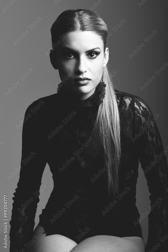 Blonde woman wearing shirt with a ponytail Blonde woman wearing shirt with a ponytail