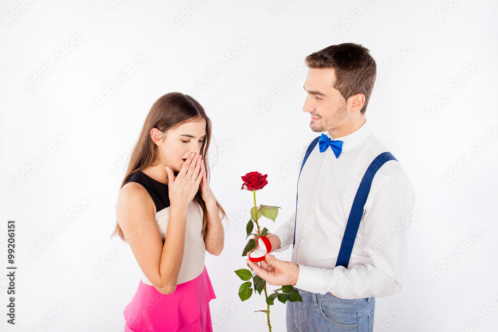 Handsome boy making proposal for his girlfriend Handsome boy making proposal for his girlfriend