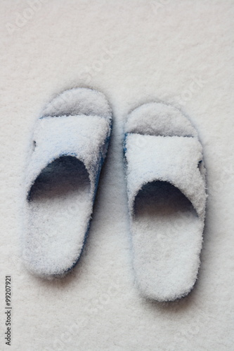 Slippers with snow at outside
