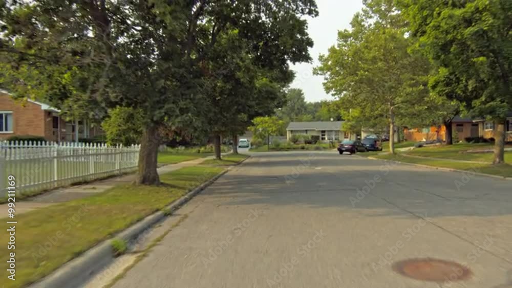 Driving plate: rear view, 1950s-70s single-storey, ranch-style houses in Mid West US neighborhood. Intended for compositing. 24mm lens, stabilized clip,slow speed, originally recorded in 4K, UHD. Driving plate: rear view, 1950s-70s single-storey, ranch-style houses in Mid West US neighborhood. Intended for compositing. 24mm lens, stabilized clip,slow speed, originally recorded in 4K, UHD.
