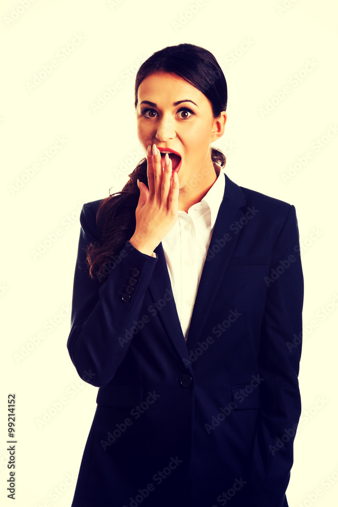 Businesswoman covering her mouth Businesswoman covering her mouth