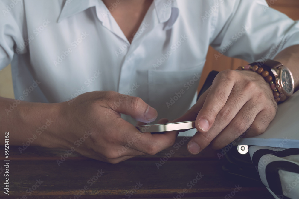 businessman using a mobile phone with texting message businessman using a mobile phone with texting message