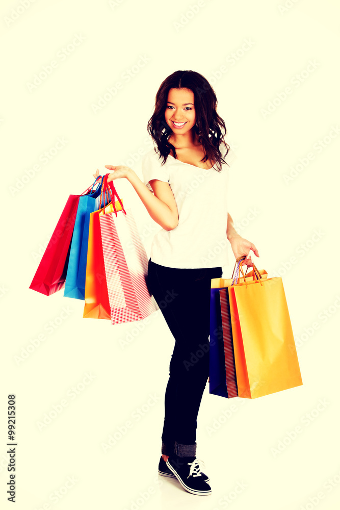 Happy smiling woman with shopping bags.