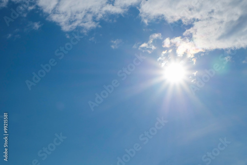 sun on blue sky with cloud  image with flare effect from lens