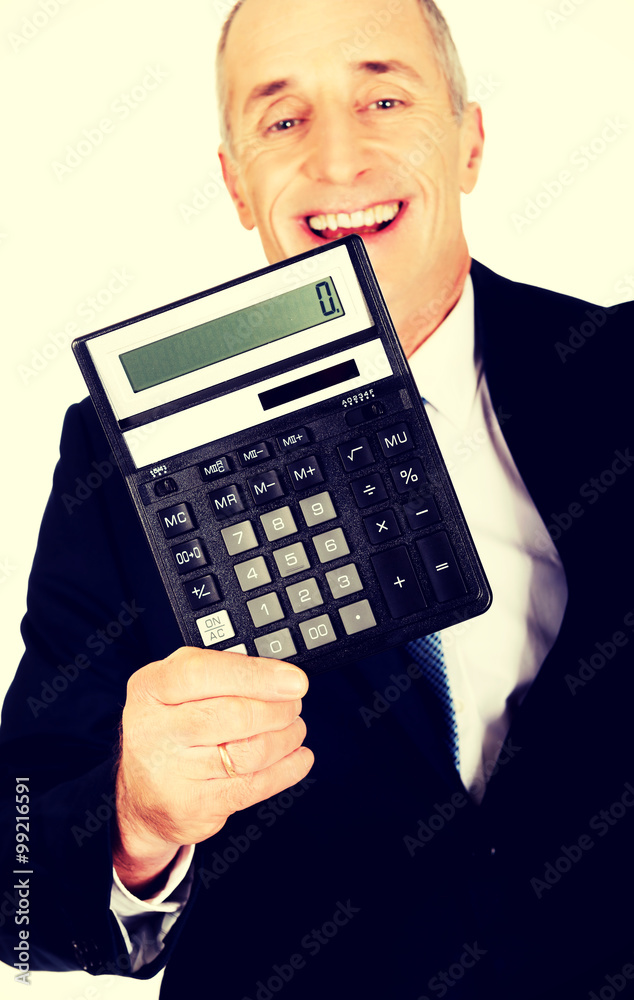 Happy businessman holding a calculator Happy businessman holding a calculator