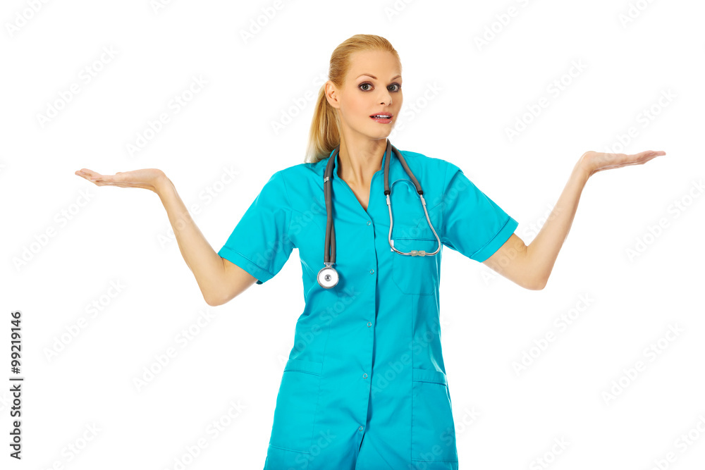 Smiling female doctor or nurse presenting copyspace or something on open palms Smiling female doctor or nurse presenting copyspace or something on open palms